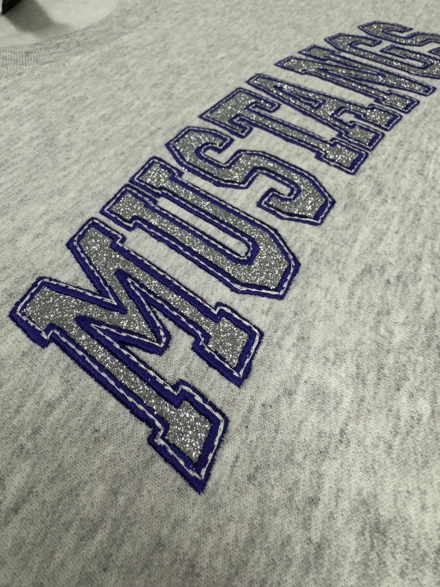 Embroidery MUSTANGS with silver glitter on Ash Crewneck